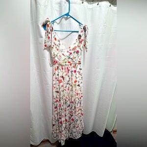 MacDuggal formal gown. Faux ties at the shoulder. Zipper closure.